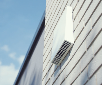 AIRUNIT decentralised domestic ventilation external wall terminal installed on a modern residential building